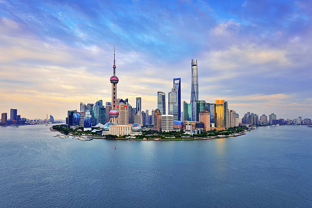 Shanghai skyline panoramic in the dramatic sky at sunset.